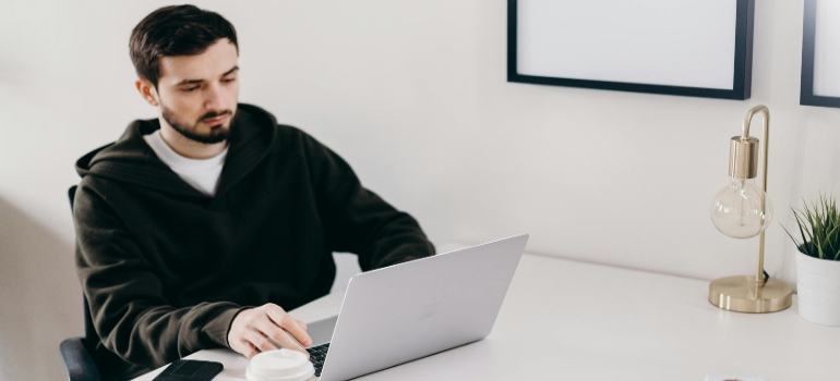 A man researching a moving company.