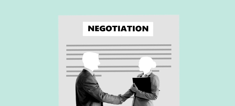 A picture of a woman and man making a deal.