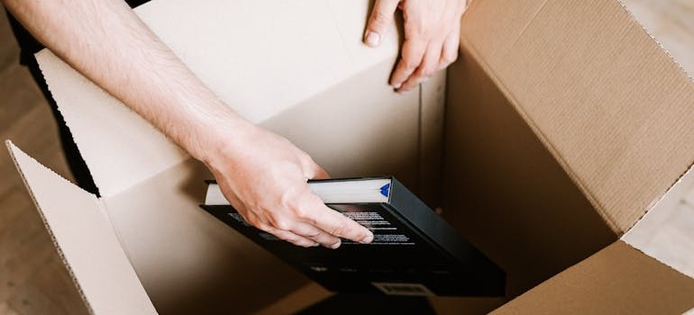 A person packing boxes