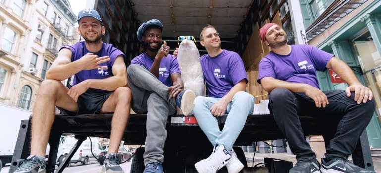 Furniture movers Queens sitting in the back of a truck
