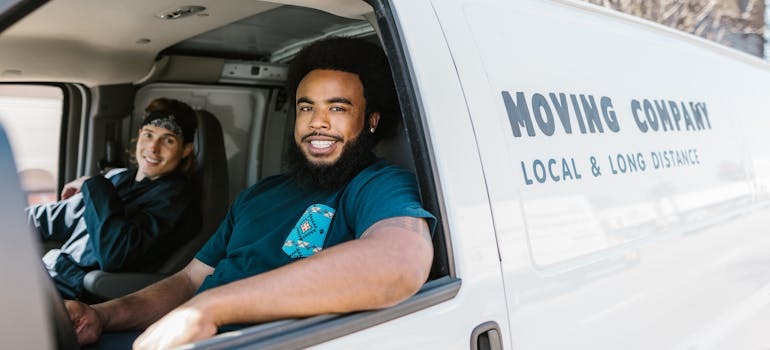 Movers in a van ready to help with handling complexities of moving a restaurant in NYC