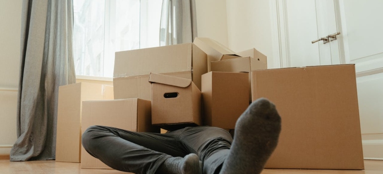 a man covered with boxes