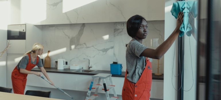 cleaning ladies cleaning home before people move out